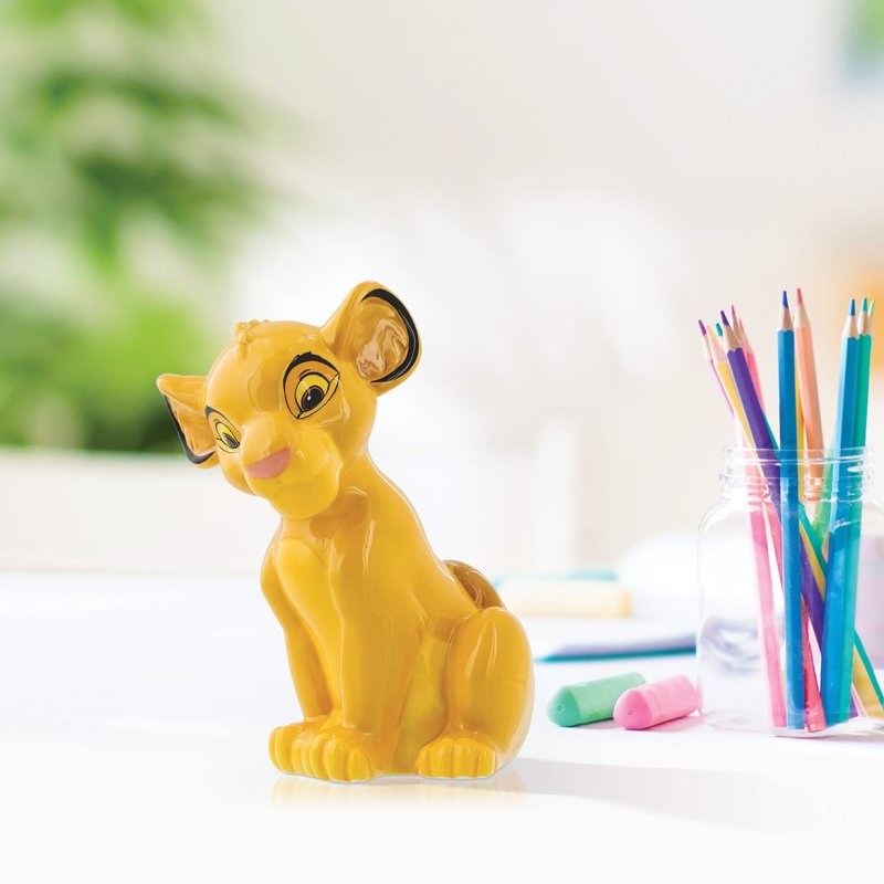 Roar into savings with the Disney Simba Money Bank. This majestic bank, featuring the Lion King's heir, safeguards your treasure while adding pride to your savings journey. Let Simba's bravery and spirit guide your financial adventures to the circle of life